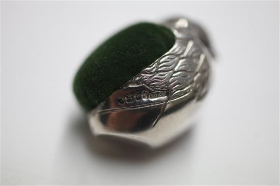 An early 20th century novelty silver pin cushion, modelled as a hatching chick by Sampson Mordan & Co & 3 others.
